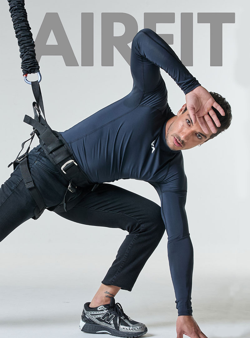 Man performing bungee fitness workout using suspension resistance training system