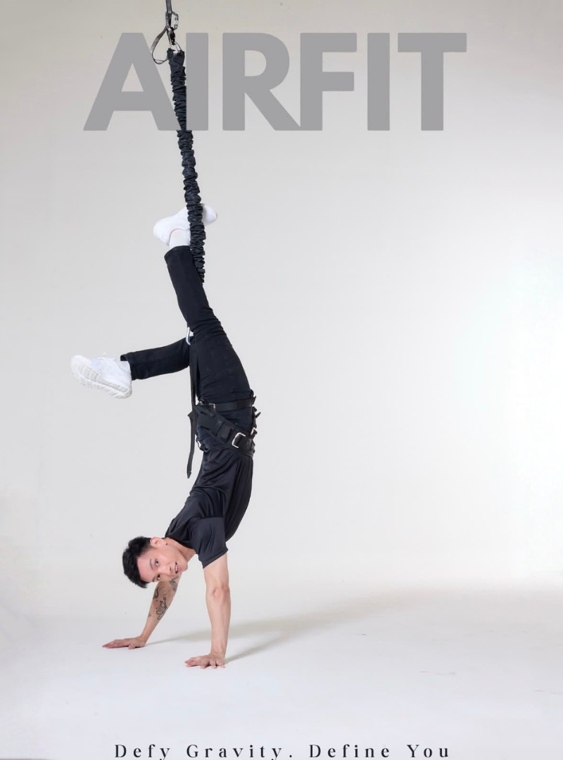 Professional athlete demonstrating advanced AIRFIT bungee suspension workout and body control